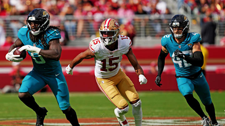 Sep 28, 2025; Santa Clara, California, USA; Jacksonville Jaguars linebacker Devin Lloyd (0) returns an intercepted pass against San Francisco 49ers wide receiver Jauan Jennings (15) during the second half at Levi's Stadium. Mandatory Credit: Darren Yamashita-Imagn Images Sep 28, 2025; Santa Clara, California, USA; Jacksonville Jaguars linebacker Devin Lloyd (0) returns an intercepted pass against San Francisco 49ers wide receiver Jauan Jennings (15) during the second half at Levi's Stadium. Mandatory Credit: Darren Yamashita-Imagn Images