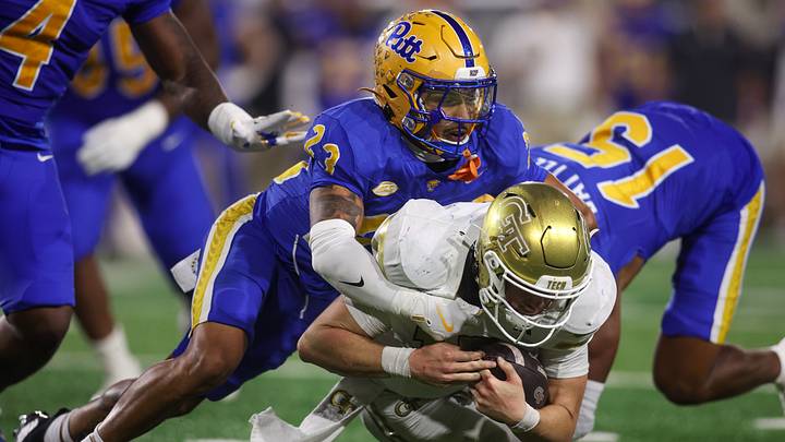 Nov 22, 2025; Atlanta, Georgia, USA; Pittsburgh Panthers defensive back Kavir Bains (23) tackles Georgia Tech Yellow Jackets quarterback Haynes King (10) in the fourth quarter at Bobby Dodd Stadium at Hyundai Field. Mandatory Credit: Brett Davis-Imagn Images Nov 22, 2025; Atlanta, Georgia, USA; Pittsburgh Panthers defensive back Kavir Bains (23) tackles Georgia Tech Yellow Jackets quarterback Haynes King (10) in the fourth quarter at Bobby Dodd Stadium at Hyundai Field. Mandatory Credit: Brett Davis-Imagn Images