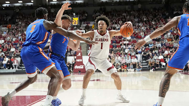 Mar 5, 2025; Tuscaloosa, AL, USA;  Florida center Rueben Chinyelu (9) and Florida guard Urban Klavzar (7) stop a drive by Alabama guard Mark Sears (1) at Coleman Coliseum. Mandatory Credit: Gary Cosby Jr./USA TODAY Network via Imagn Images
