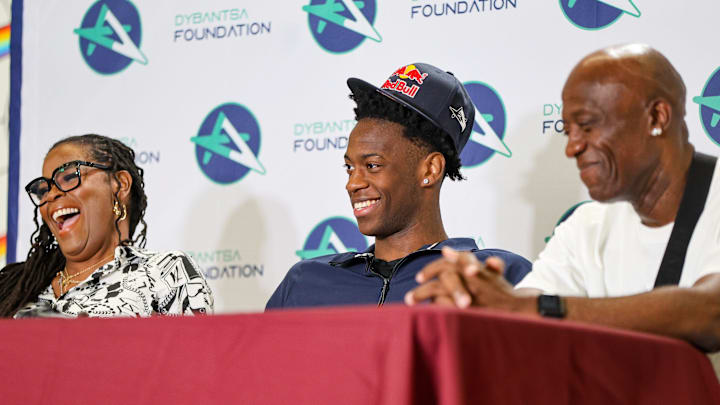 Next to his mother Chelsea and father Ace, Brockton’s AJ Dybantsa declares for the 2026 NBA Draft at Davis School (K-8) in Brockton, Massachusetts on Thursday, April 23, 2026.