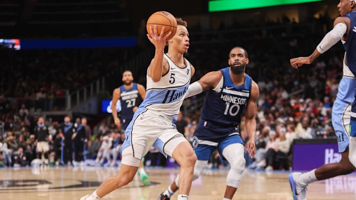 Dec 23, 2024; Atlanta, Georgia, USA; Atlanta Hawks guard Dyson Daniels (5) drives past Minnesota Timberwolves guard Mike Conley (10) in the second quarter at State Farm Arena. Mandatory Credit: Brett Davis-Imagn Images Dec 23, 2024; Atlanta, Georgia, USA; Atlanta Hawks guard Dyson Daniels (5) drives past Minnesota Timberwolves guard Mike Conley (10) in the second quarter at State Farm Arena. Mandatory Credit: Brett Davis-Imagn Images