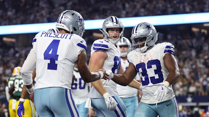 Sep 28, 2025; Arlington, Texas, USA; Dallas Cowboys running back Javonte Williams (33) celebrates with quarterback Dak Prescott (4) after scoring a touchdown against the Green Bay Packers in the fourth quarter at AT&T Stadium. Mandatory Credit: Kevin Jairaj-Imagn Images