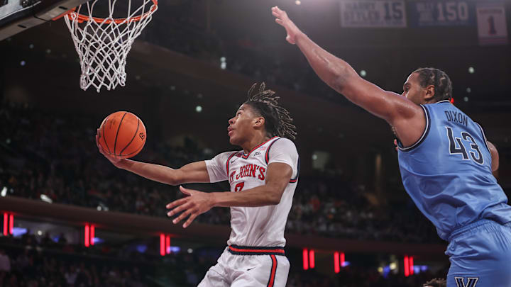 Jan 11, 2025; New York, New York, USA;  St. John's basketball guard Simeon Wilcher (7) drives to the basket against Villanova Wildcats forward Eric Dixon (43) in the second half at Madison Square Garden.