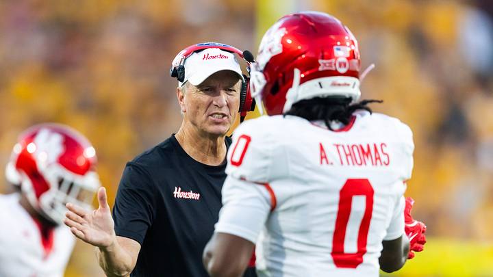 Oct 25, 2025; Tempe, Arizona, USA; Houston Cougars head coach Willie Fritz with wide receiver Amare Thomas (0) against the Arizona State Sun Devils at Mountain America Stadium. Mandatory Credit: Mark J. Rebilas-Imagn Images Oct 25, 2025; Tempe, Arizona, USA; Houston Cougars head coach Willie Fritz with wide receiver Amare Thomas (0) against the Arizona State Sun Devils at Mountain America Stadium. Mandatory Credit: Mark J. Rebilas-Imagn Images