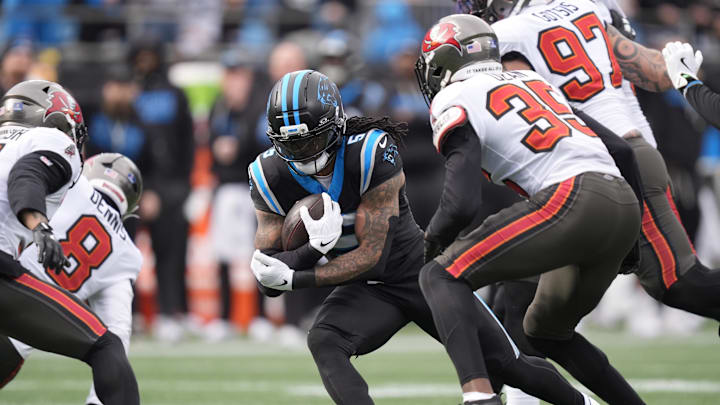 Dec 21, 2025; Charlotte, North Carolina, USA; Carolina Panthers running back Rico Dowdle (5) runs during the first half against the Tampa Bay Buccaneers at Bank of America Stadium. Mandatory Credit: Jim Dedmon-Imagn Images Dec 21, 2025; Charlotte, North Carolina, USA; Carolina Panthers running back Rico Dowdle (5) runs during the first half against the Tampa Bay Buccaneers at Bank of America Stadium. Mandatory Credit: Jim Dedmon-Imagn Images