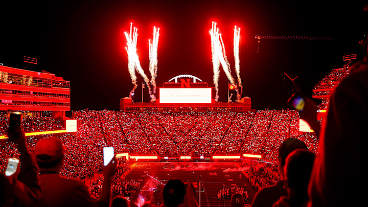 Oct 1, 2022; Lincoln, Nebraska, USA; Fans participate in a light show at the end of the third quarter between the Nebraska Cornhuskers and the Indiana Hoosiers at Memorial Stadium. 