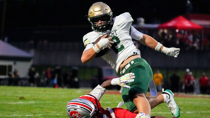 City High’s Damari Lacy (6) tackles Iowa City West’s Mikey Moody (2) during a week 1 Iowa high school football game Aug. 29, 2025 at Iowa City City High in Iowa City, Iowa.
