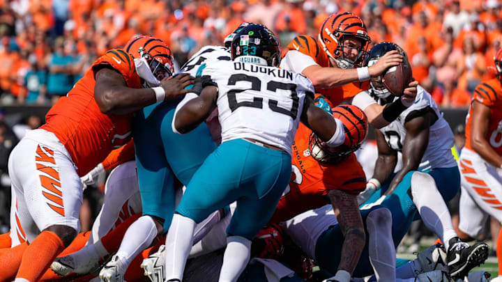 Cincinnati Bengals quarterback Jake Browning (6) leaps over the line for a go-ahead touchdown in the fourth quarter of the NFL Week 2 game between the Cincinnati Bengals and the Jacksonville Jaguars at Paycor Stadium in downtown Cincinnati on Sunday, Sept. 14, 2025. The Bengals came back from a halftime deficit to win 31-27.