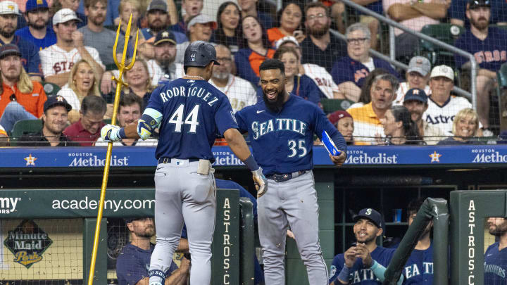 Seattle Mariners right fielder Teoscar Hernandez (35) celebrates center fielder Julio Rodriguez (44) home run against the Houston Astros in the third inning  inning at Minute Maid Park in 2023.