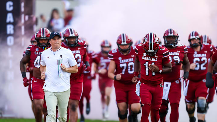 Nov 22, 2025; Columbia, South Carolina, USA; South Carolina Gamecocks head coach Shane Beamer leads his team onto the field before their game against the Coastal Carolina Chanticleers at Williams-Brice Stadium. Mandatory Credit: Jeff Blake-Imagn Images