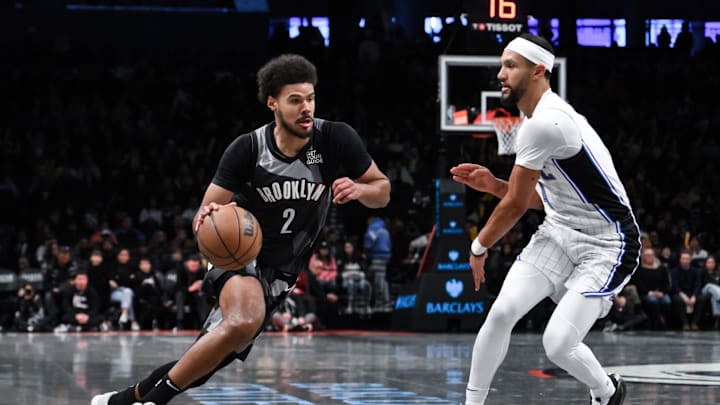 Dec 1, 2024; Brooklyn, New York, USA; Brooklyn Nets forward Cameron Johnson (2) drives to the basket while being defended by Orlando Magic guard Jalen Suggs (4) during the second half at Barclays Center. Mandatory Credit: John Jones-Imagn Images