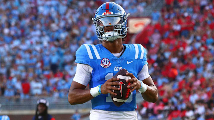 Sep 13, 2025; Oxford, Mississippi, USA; Mississippi Rebels quarterback Austin Simmons (13) warm ups between the first and second quarters against the Arkansas Razorback at Vaught-Hemingway Stadium. Mandatory Credit: Petre Thomas-Imagn Images