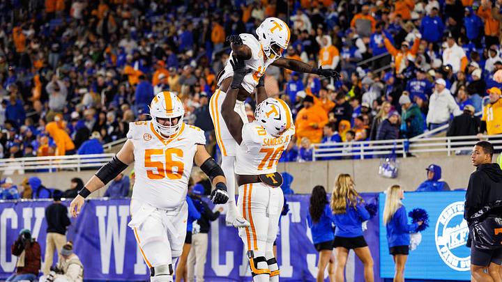 Oct 25, 2025; Lexington, Kentucky, USA; Tennessee Volunteers offensive lineman David Sanders Jr. (70) celebrates with wide receiver Mike Matthews (4) after Matthews scores a touchdown during the third quarter against the Kentucky Wildcats at Kroger Field. Mandatory Credit: Jordan Prather-Imagn Images Oct 25, 2025; Lexington, Kentucky, USA; Tennessee Volunteers offensive lineman David Sanders Jr. (70) celebrates with wide receiver Mike Matthews (4) after Matthews scores a touchdown during the third quarter against the Kentucky Wildcats at Kroger Field. Mandatory Credit: Jordan Prather-Imagn Images