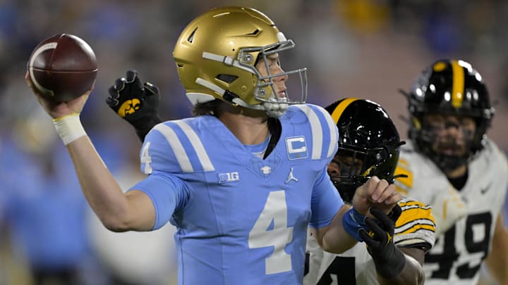 Nov 8, 2024; Pasadena, California, USA;   UCLA Bruins quarterback Ethan Garbers (4) looks to pass in the first half against the Iowa Hawkeyes at the Rose Bowl. Mandatory Credit: Jayne Kamin-Oncea-Imagn Images