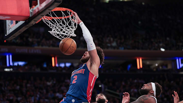 Feb 19, 2026; New York, New York, USA; Detroit Pistons guard Cade Cunningham (2) dunks against New York Knicks center Karl-Anthony Towns (32) during the second half at Madison Square Garden. Mandatory Credit: Vincent Carchietta-Imagn Images