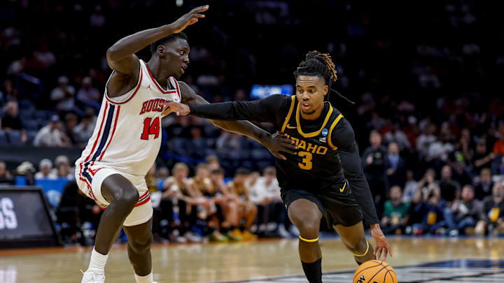 Mar 19, 2026; Oklahoma City, OK, USA; Idaho Vandals guard Biko Johnson (3) dribbles the ball while Houston Cougars forward Kalifa Sakho (14) defends during a first round game of the men's 2026 NCAA Tournament at Paycom Center. Mandatory Credit: Alonzo Adams-Imagn Images