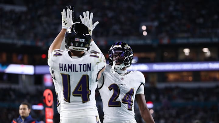 Oct 30, 2025; Miami Gardens, Florida, USA;  Baltimore Ravens safety Kyle Hamilton (14) and safety Malaki Starks (24) react after a play during the second quarter against the Miami Dolphins at Hard Rock Stadium. Mandatory Credit: Nathan Ray Seebeck-Imagn Images