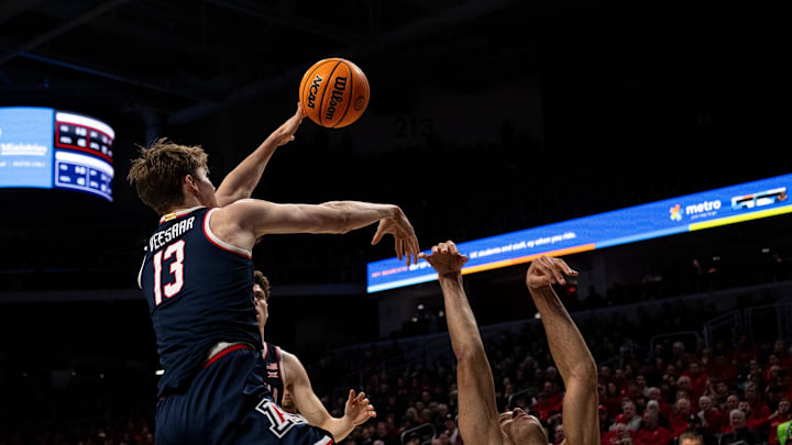Arizona Wildcats forward Henri Veesaar (13) is called for a foul on Cincinnati Bearcats guard Dan Skillings Jr. (0) in the first half of the NCAA basketball game at the Fifth Third Arena in Cincinnati on Saturday, January 4, 2025.