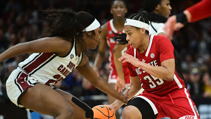 Apr 5, 2024; Cleveland, OH, USA; NC State Wolfpack guard Zoe Brooks (35) dribbles the ball against South Carolina Gamecocks guard Raven Johnson (25) in the semifinals of the Final Four of the womens 2024 NCAA Tournament at Rocket Mortgage FieldHouse. Mandatory Credit: Ken Blaze-Imagn Images Apr 5, 2024; Cleveland, OH, USA; NC State Wolfpack guard Zoe Brooks (35) dribbles the ball against South Carolina Gamecocks guard Raven Johnson (25) in the semifinals of the Final Four of the womens 2024 NCAA Tournament at Rocket Mortgage FieldHouse. Mandatory Credit: Ken Blaze-Imagn Images
