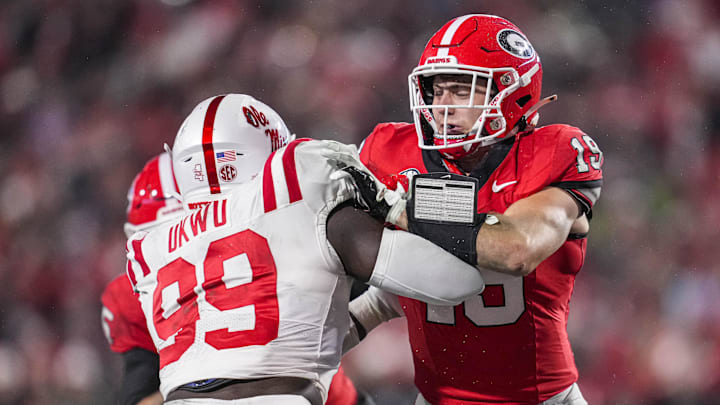 Nov 11, 2023; Athens, Georgia, USA; A Georgia Bulldogs tight end Brock Bowers (19) blocks against Mississippi Rebels defensive end Isaac Ukwu (99) during the second half at Sanford Stadium. Mandatory Credit: Dale Zanine-Imagn Images