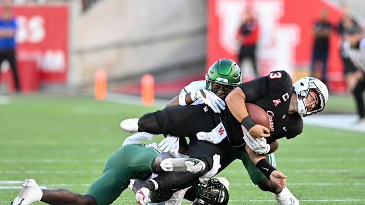 Sep 30, 2022; Then-Tulane Green Wave linebacker Corey Platt Jr. (45) and linebacker Darius Hodges (6) tackle Houston Cougars quarterback Clayton Tune (3) during the first half at TDECU Stadium in Houston, Texas. Sep 30, 2022; Then-Tulane Green Wave linebacker Corey Platt Jr. (45) and linebacker Darius Hodges (6) tackle Houston Cougars quarterback Clayton Tune (3) during the first half at TDECU Stadium in Houston, Texas.