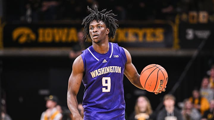 Feb 22, 2025; Iowa City, Iowa, USA; Washington Huskies guard Zoom Diallo (9) controls the ball against the Iowa Hawkeyes during the first half at Carver-Hawkeye Arena. Mandatory Credit: Jeffrey Becker-Imagn Images