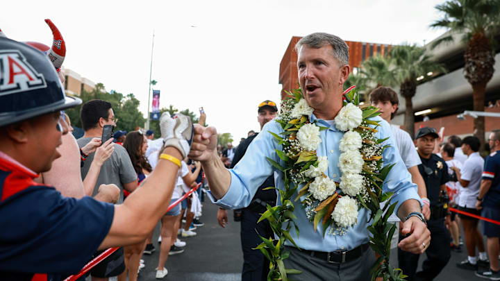 Aug 31, 2024; Tucson, Arizona, USA; Arizona Wildcat head coach Brent Brennan interacts with fans as he walks down the Wildcat Walk before a game against the New Mexico Lobos at Arizona Stadium. Mandatory Credit: Aryanna Frank-Imagn Images