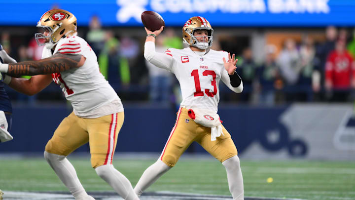 Jan 17, 2026; Seattle, WA, USA; San Francisco 49ers quarterback Brock Purdy (13) throws downfield against the Seattle Seahawks during the first half in an NFC Divisional Round game at Lumen Field. Mandatory Credit: Steven Bisig-Imagn Images