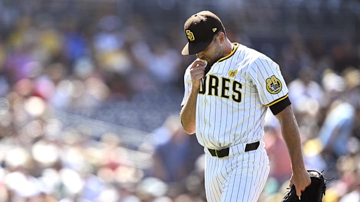Jun 26, 2024; San Diego, California, USA; San Diego Padres relief pitcher Tom Cosgrove (59) walks to the dugout after a pitching change in the ninth inning against the Washington Nationals at Petco Park. Mandatory Credit: Orlando Ramirez-Imagn Images