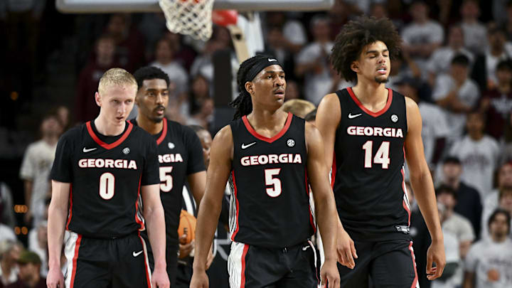 Feb 11, 2025; College Station, Texas, USA; Georgia Bulldogs guard Blue Cain (0), guard Silas Demary Jr. (5) and forward Asa Newell (14) walk on the court during the second half against the Texas A&M Aggies at Reed Arena. Mandatory Credit: Maria Lysaker-Imagn Images 