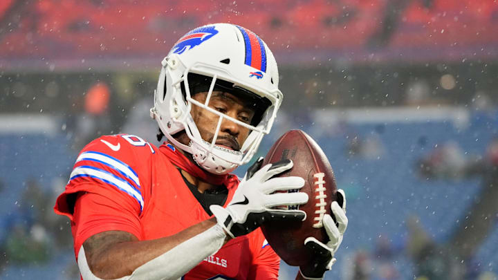 Dec 28, 2025; Orchard Park, New York, USA; Buffalo Bills wide receiver Brandin Cooks (18) warms up in the rain before the game against the Philadelphia Eagles at Highmark Stadium. Mandatory Credit: Gregory Fisher-Imagn Images