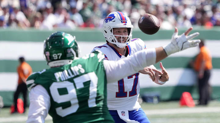 Sep 14, 2025; East Rutherford, New Jersey, USA; Buffalo Bills quarterback Josh Allen (17) makes a throw against New York Jets defensive tackle Harrison Phillips (97) during the first half at MetLife Stadium. Mandatory Credit: Robert Deutsch-Imagn Images Sep 14, 2025; East Rutherford, New Jersey, USA; Buffalo Bills quarterback Josh Allen (17) makes a throw against New York Jets defensive tackle Harrison Phillips (97) during the first half at MetLife Stadium. Mandatory Credit: Robert Deutsch-Imagn Images