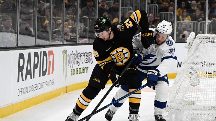 Apr 11, 2026; Boston, Massachusetts, USA; Boston Bruins defenseman Andrew Peeke (26) controls the puck against Tampa Bay Lightning center Brayden Point (21) during the first period at the TD Garden. Mandatory Credit: Brian Fluharty-Imagn Images Apr 11, 2026; Boston, Massachusetts, USA; Boston Bruins defenseman Andrew Peeke (26) controls the puck against Tampa Bay Lightning center Brayden Point (21) during the first period at the TD Garden. Mandatory Credit: Brian Fluharty-Imagn Images