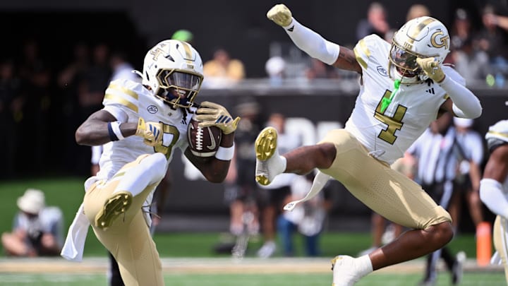 Sep 27, 2025; Winston-Salem, North Carolina, USA;  Georgia Tech Yellow Jackets defensive back Omar Daniels (9) and defensive back Daiquan White (4) celebrate during the second quarter against the Wake Forest Demon Deacons at Allegacy Federal Credit Union Stadium. Mandatory Credit: Zachary Taft-Imagn Images