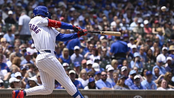 Jun 19 , 2025; Chicago, Illinois, USA;  Chicago Cubs outfielder Pete Crow-Armstrong (4) hits a two run home run against the Milwaukee Brewers during the first inning at Wrigley Field. 