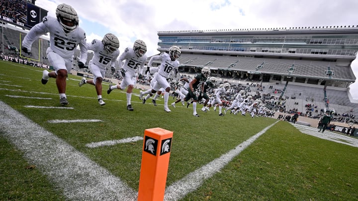Apr 16, 2022; East Lansing, Michigan, USA;  Michigan State University Spartans sprint to the end zone in a drill at Spartan Stadium. Mandatory Credit: Dale Young-USA TODAY Sports