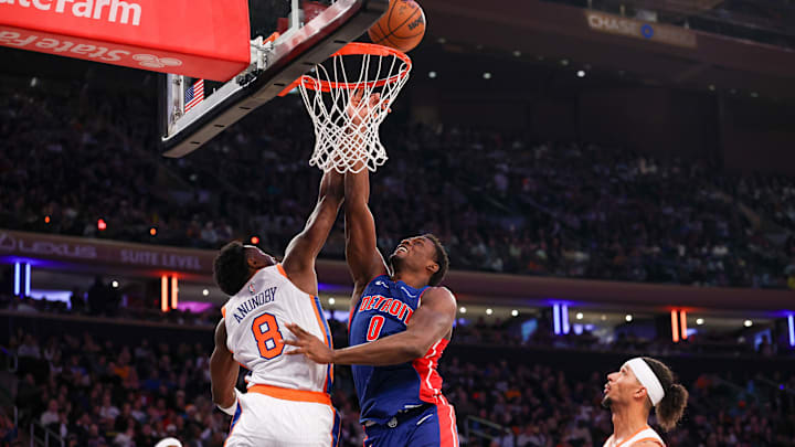 Dec 7, 2024; New York, New York, USA; New York Knicks forward OG Anunoby (8) blocks a shot by Detroit Pistons center Jalen Duren (0) during the first half at Madison Square Garden. Mandatory Credit: Vincent Carchietta-Imagn Images