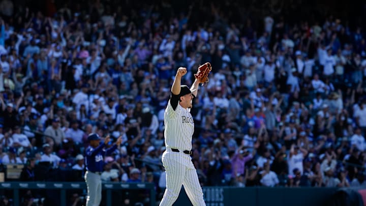 Apr 19, 2026; Denver, Colorado, USA; Colorado Rockies relief pitcher Victor Vodnik (38) reacts after the final out against the Los Angeles Dodgers at Coors Field. 