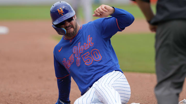Mar 15, 2026; Port St. Lucie, Florida, USA;  New York Mets right fielder Mike Tauchman (50) goes from first to third base on a hit by shortstop Francisco Lindor (12) against the Toronto Blue Jays at Clover Park. Mandatory Credit: Jim Rassol-Imagn Images