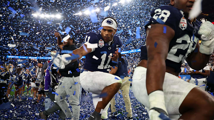 Dec 31, 2024; Glendale, AZ, USA; Penn State Nittany Lions defensive end Abdul Carter (11) reacts with teammates after defeating the Boise State Broncos in the Fiesta Bowl at State Farm Stadium.  