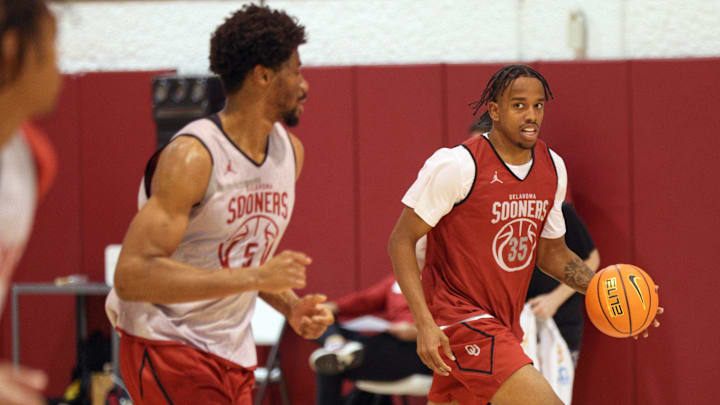 OU forward Derrion Reid, right, dribbles next to forward Mohamed Wague during practice for the Oklahoma Sooners men's basketball team at the Lloyd Noble Center in Norman, Okla., Tuesday, Oct. 28, 2025.