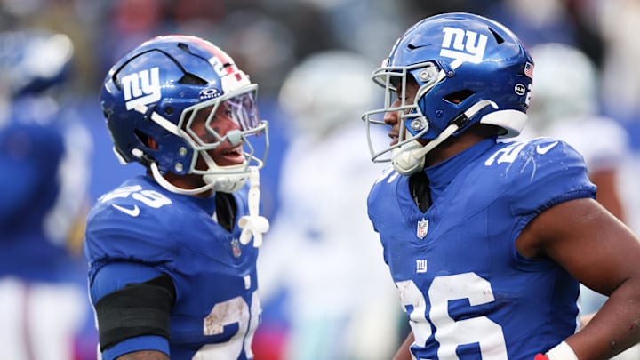 Jan 4, 2026; East Rutherford, New Jersey, USA; New York Giants running back Devin Singletary (26) celebrates with New York Giants running back Tyrone Tracy Jr. (29) after scoring a touchdown during the fourth quarter against the Dallas Cowboys at MetLife Stadium.  