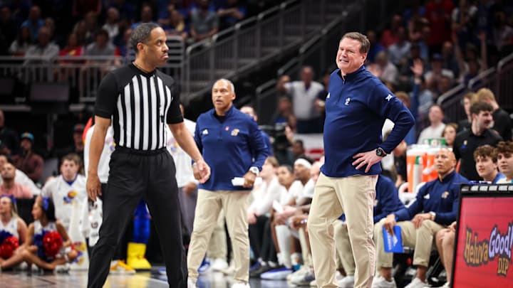 Mar 12, 2025; Kansas City, MO, USA; Kansas Jayhawks coach Bill Self speaks with the referee during the second half against the UCF Knights at T-Mobile Center. Mandatory Credit: William Purnell-Imagn Images