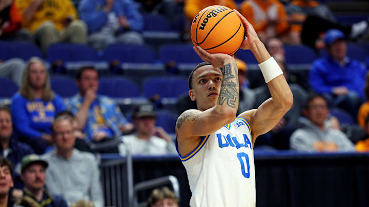 Mar 20, 2025; Lexington, KY, USA;  UCLA Bruins guard Kobe Johnson (0) shoots the ball during the second half automatically in the first round of the NCAA Tournament at Rupp Arena. Mandatory Credit: Jordan Prather-Imagn Images