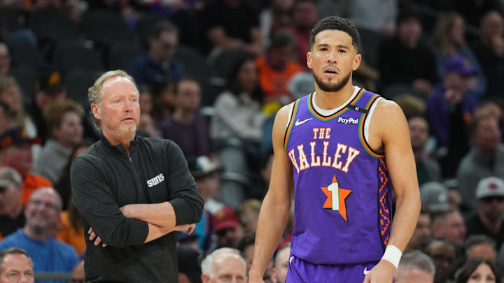 Jan 11, 2025; Phoenix, Arizona, USA; Phoenix Suns head coach Mike Budenholzer looks on alongside Phoenix Suns guard Devin Booker (1) against the Utah Jazz during the first half at Footprint Center. Mandatory Credit: Joe Camporeale-Imagn Images Jan 11, 2025; Phoenix, Arizona, USA; Phoenix Suns head coach Mike Budenholzer looks on alongside Phoenix Suns guard Devin Booker (1) against the Utah Jazz during the first half at Footprint Center. Mandatory Credit: Joe Camporeale-Imagn Images
