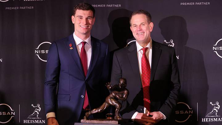 Dec 13, 2025; New York, NY, USA; Indiana Hoosiers quarterback Fernando Mendoza (left) and head coach Curt Cignetti pose for photos with the Heisman trophy during a press conference at the New York Marriott Marquis after Mendoza wins the award. Mandatory Credit: Brad Penner-Imagn Images Dec 13, 2025; New York, NY, USA; Indiana Hoosiers quarterback Fernando Mendoza (left) and head coach Curt Cignetti pose for photos with the Heisman trophy during a press conference at the New York Marriott Marquis after Mendoza wins the award. Mandatory Credit: Brad Penner-Imagn Images