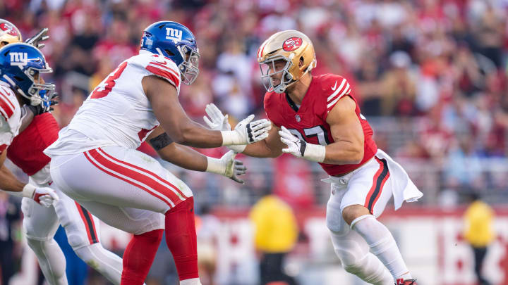 September 21, 2023; Santa Clara, California, USA; San Francisco 49ers defensive end Nick Bosa (97) rushes New York Giants offensive tackle Evan Neal (73) during the second quarter at Levi's Stadium.  