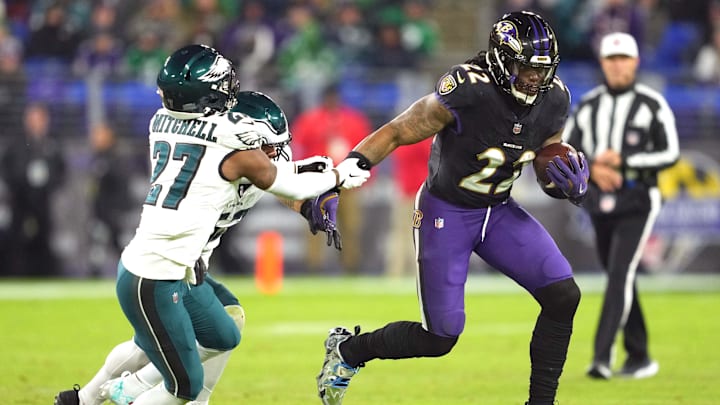 Dec 1, 2024; Baltimore, Maryland, USA; Baltimore Ravens running back Derrick Henry (22) runs for a third quarter gain defended by Philadelphia Eagles cornerback Quinyon Mitchell (27) at M&T Bank Stadium. Mandatory Credit: Mitch Stringer-Imagn Images Dec 1, 2024; Baltimore, Maryland, USA; Baltimore Ravens running back Derrick Henry (22) runs for a third quarter gain defended by Philadelphia Eagles cornerback Quinyon Mitchell (27) at M&T Bank Stadium. Mandatory Credit: Mitch Stringer-Imagn Images