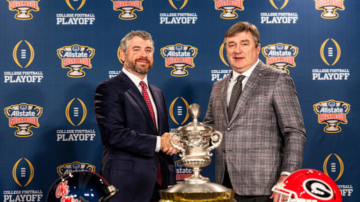 Ole Miss head coach Pete Golding and Georgia head coach Kirby Smart shake hands while posing for pictures during a press conference for the Sugar Bowl and College Football Playoff quarterfinals at the Sheraton New Orleans Hotel in New Orleans, La., on Wednesday, Dec. 31, 2025.