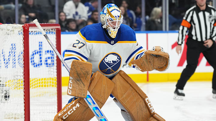 Dec 15, 2024; Toronto, Ontario, CAN; Buffalo Sabres goaltender Devon Levi (27) follows the play against the Toronto Maple Leafs during the third period at Scotiabank Arena. Mandatory Credit: Nick Turchiaro-Imagn Images
